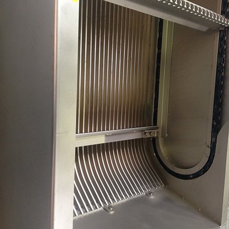 Curved coarse bar rack at channel bottom promotes better capture.